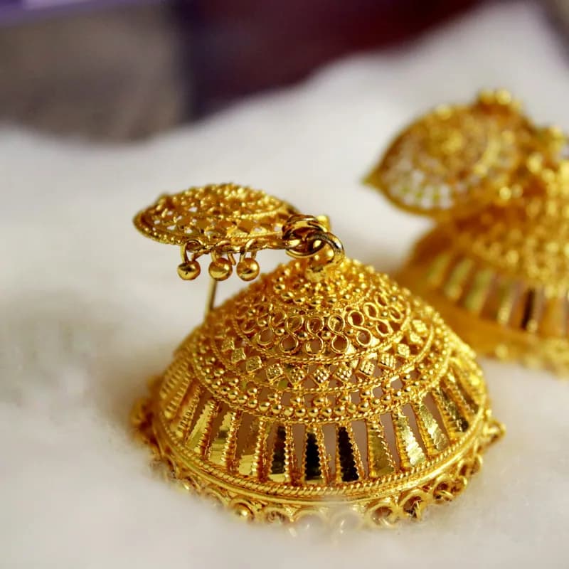 Ornate gold jhumka earrings